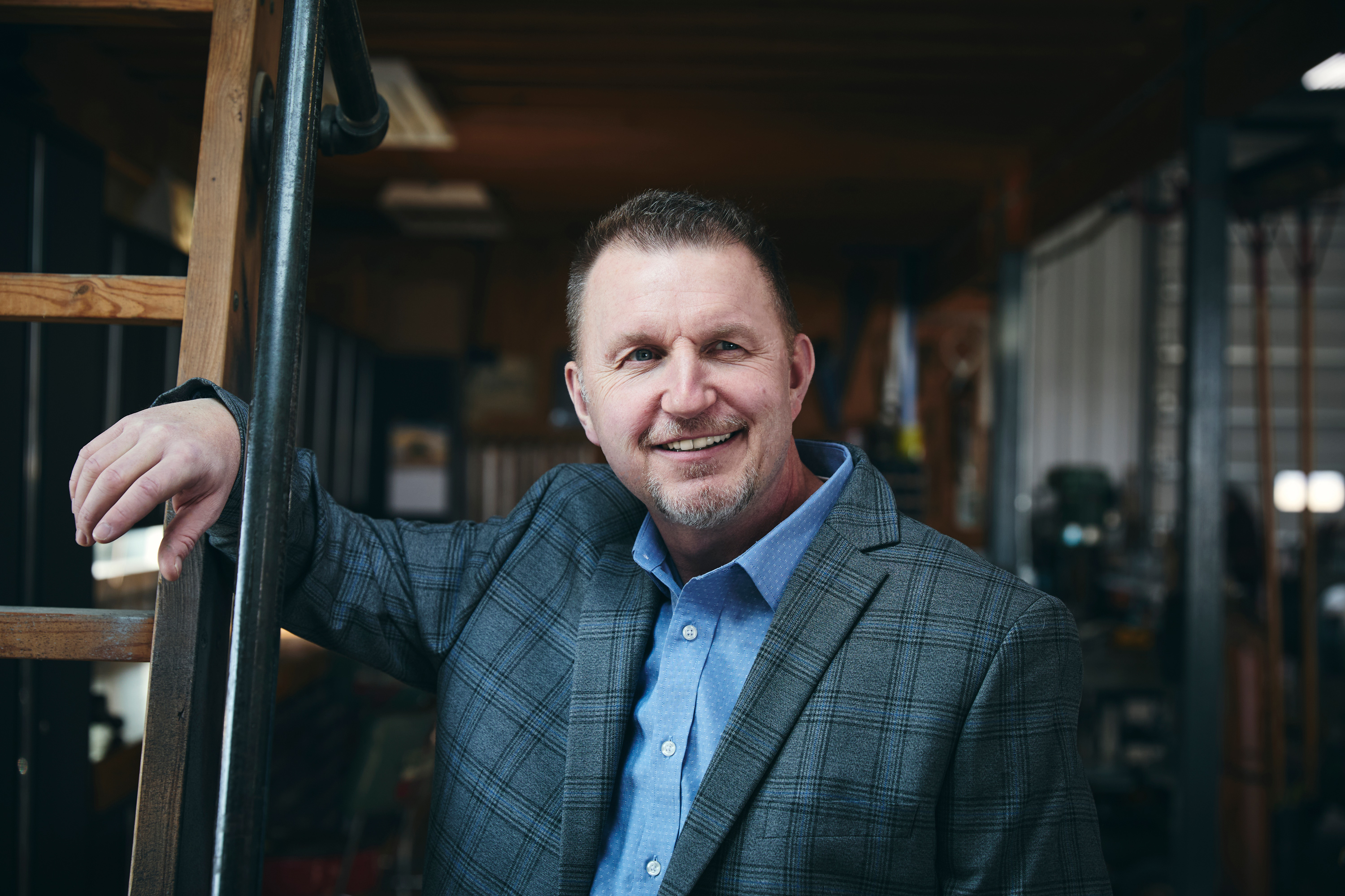 Author Robert Cummer in a blue shirt and checked jacket